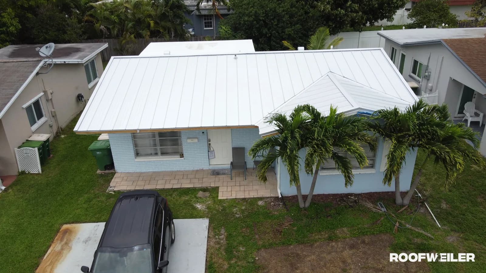 Aerial drone photo of a completed standing seam metal roof replacement on a single-family home in Tamarac, Broward County — a representative Roofweiler project minutes from Coral Springs